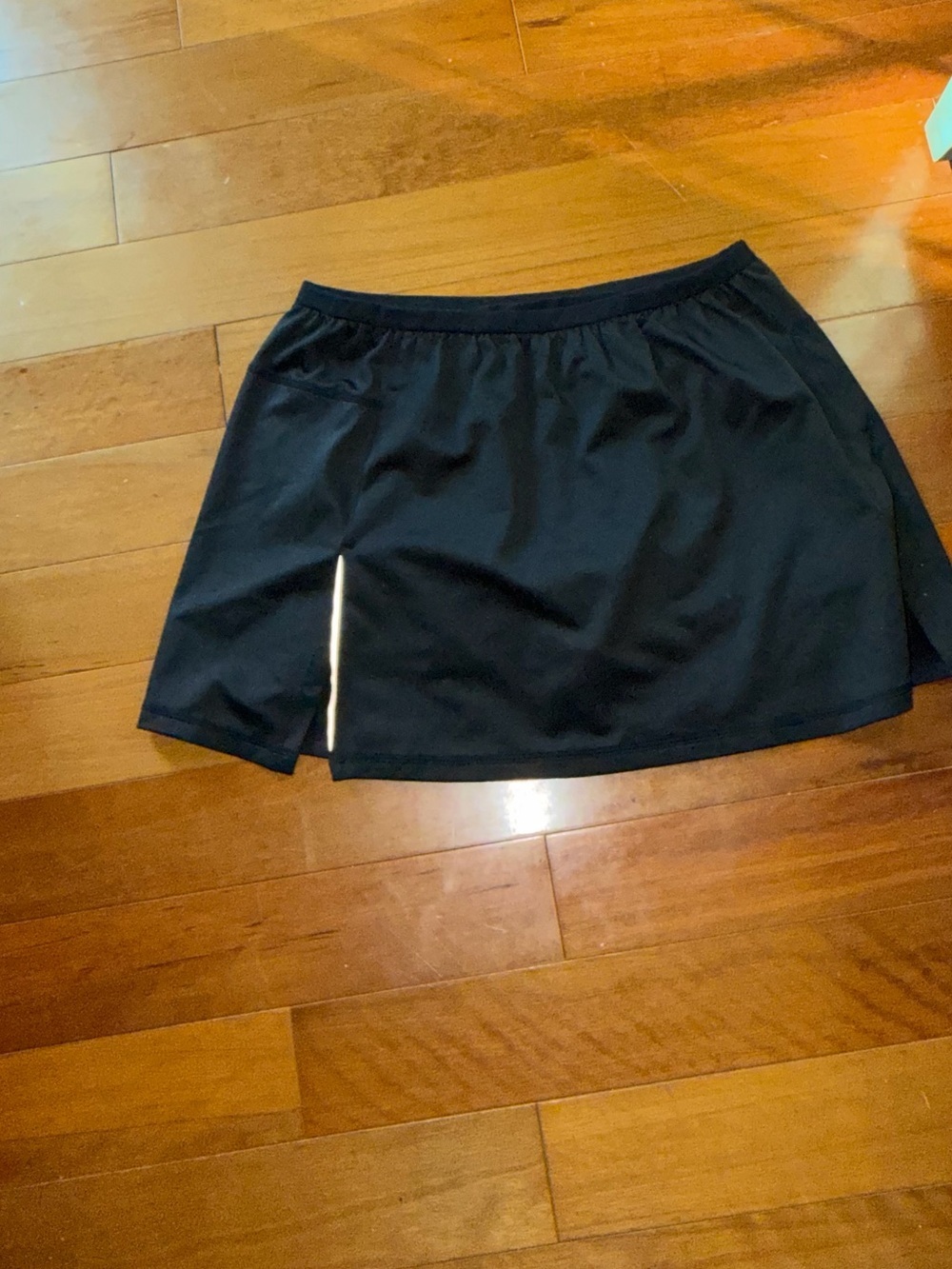 New Balance Athletic black skirt with shorts underneath.